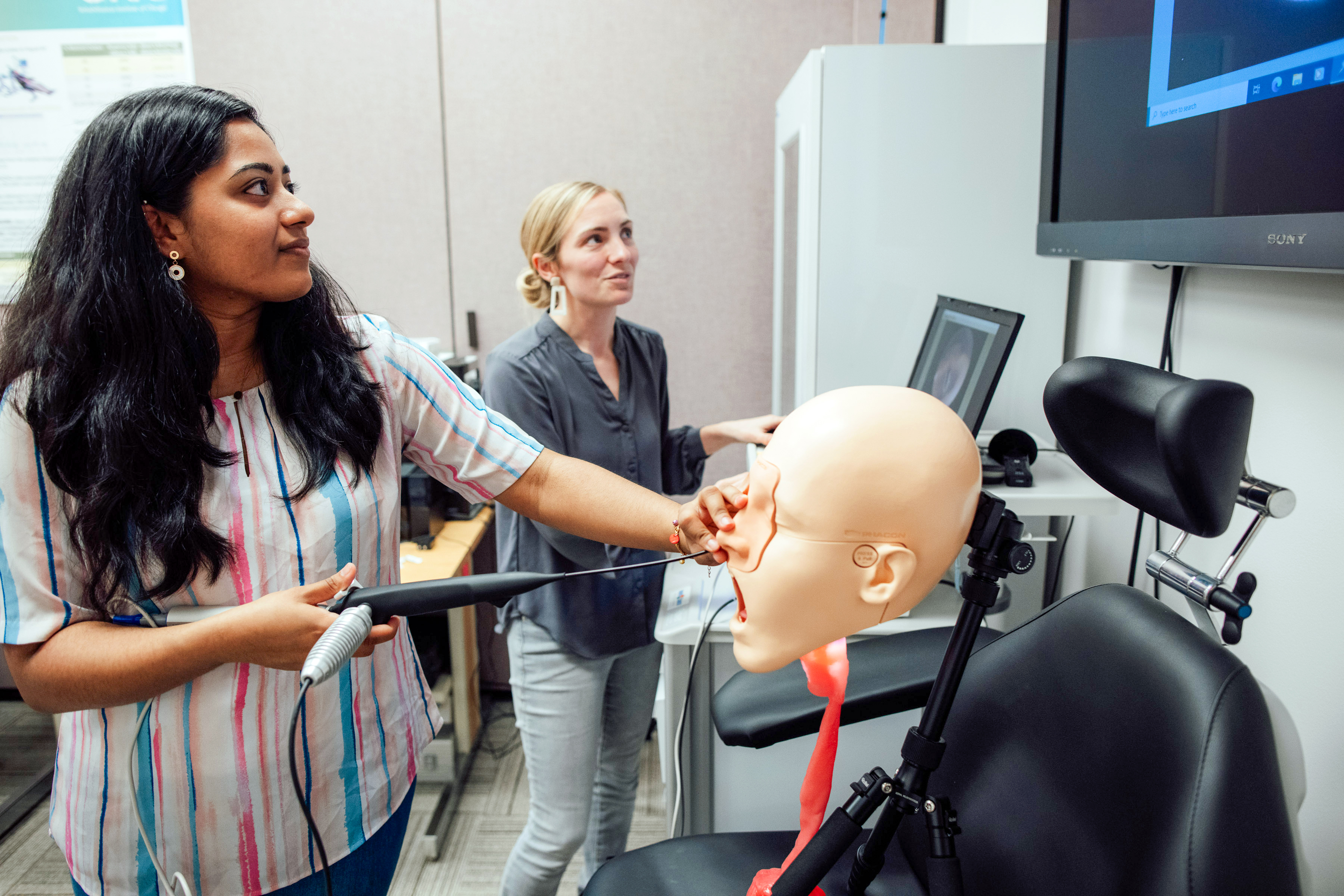 Communications disorders student performing research.