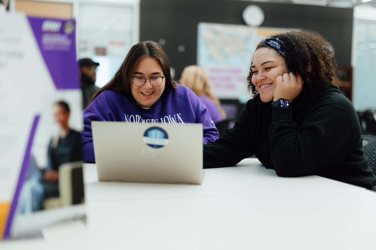 Students working on a laptop