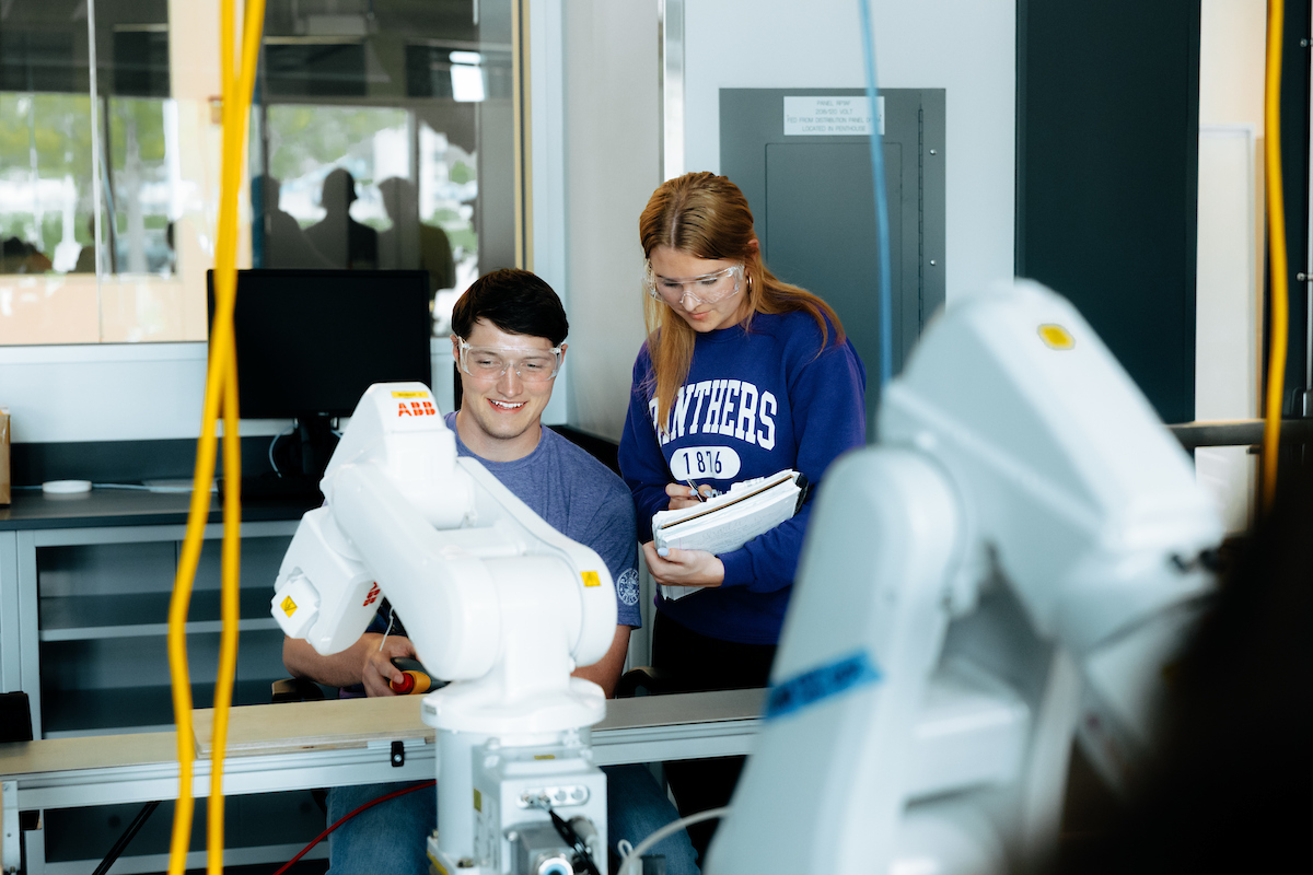 Students working with engineering equipment