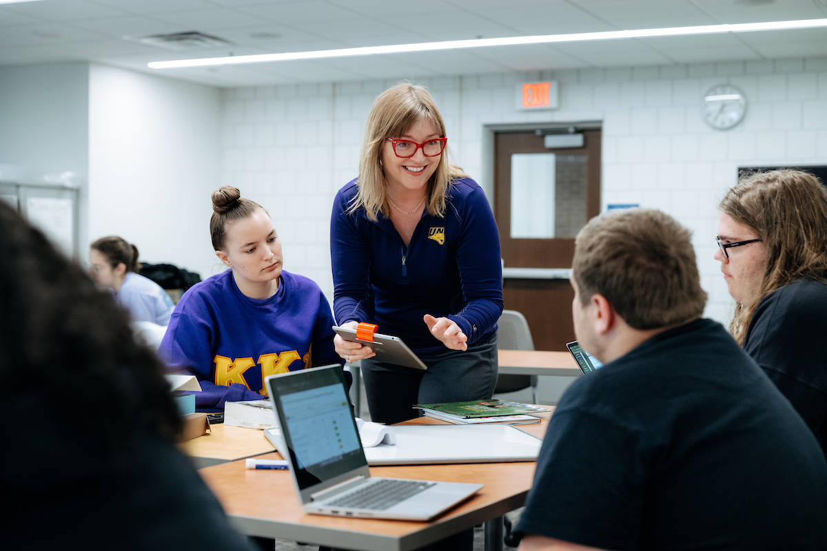 Professor helping students