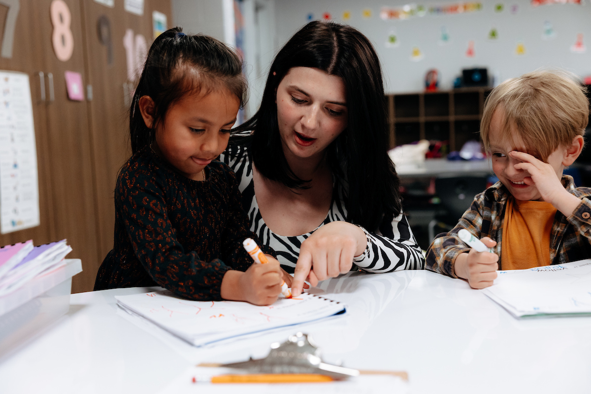 Student teacher working with students