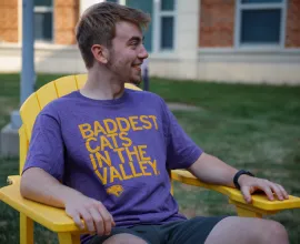 Student wearing Baddest Cats in the Valley t-shirt